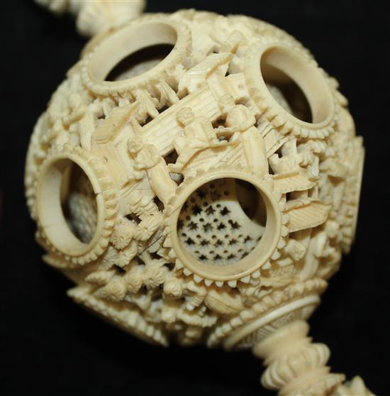 A Chinese export ivory hanging puzzle ball, 19th century, 34cm incl. chain